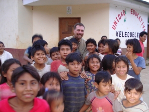 Jeff Solheim surrounded by children in a village PHH visited