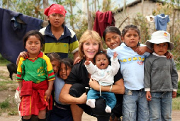 Doctor posing with patients and family in the Andes