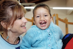 Kathy Majette with a boy in Paraguay who was born with a cleft lip