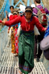 Woman crossing a bridge