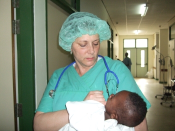Doctor consoling an infant
